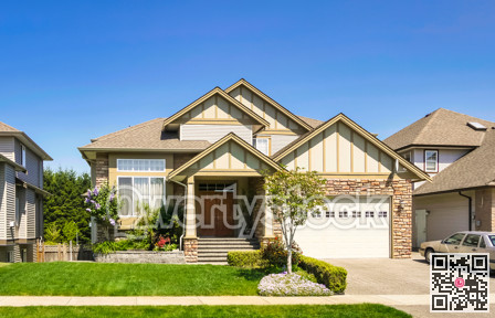 Luxury family house with car parked on concrete driveway