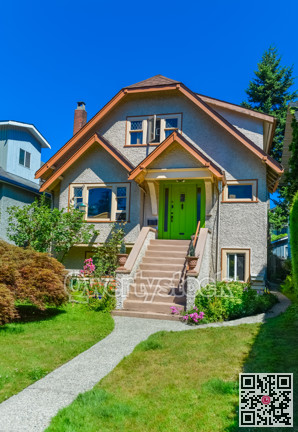 Residential house with the pathway over front yard lawn on blue sky background