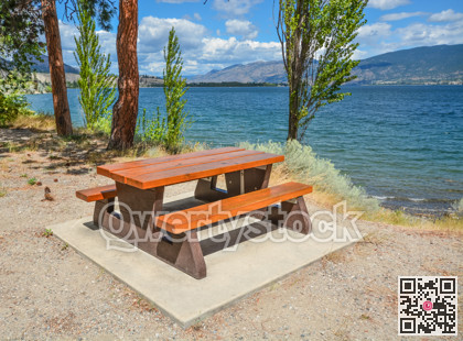 Picnic table and benches on Okanagan lake shore
