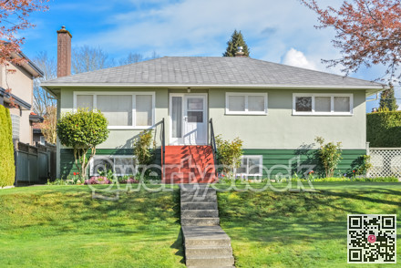 Average residential house on land terrace on blue sky background