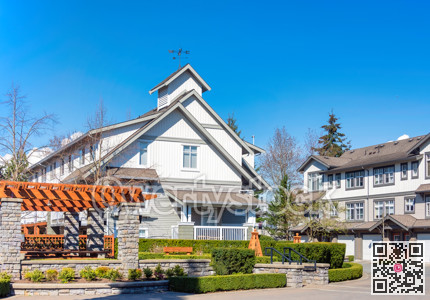 Entry plaza of a residential community on bright sunny day