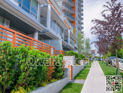 Concrete pathway along brand new residential building