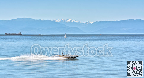 Power motor boat running over the bay with tourist tour