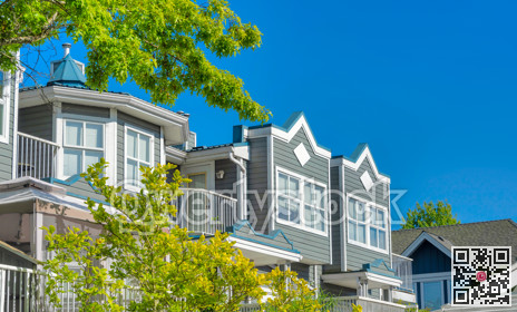 Top of residential building on blue sky background