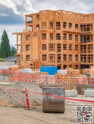 Construction of the residential building on cloudy sky background