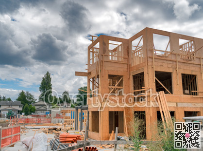 Low-rise residential building under construction on cloudy day